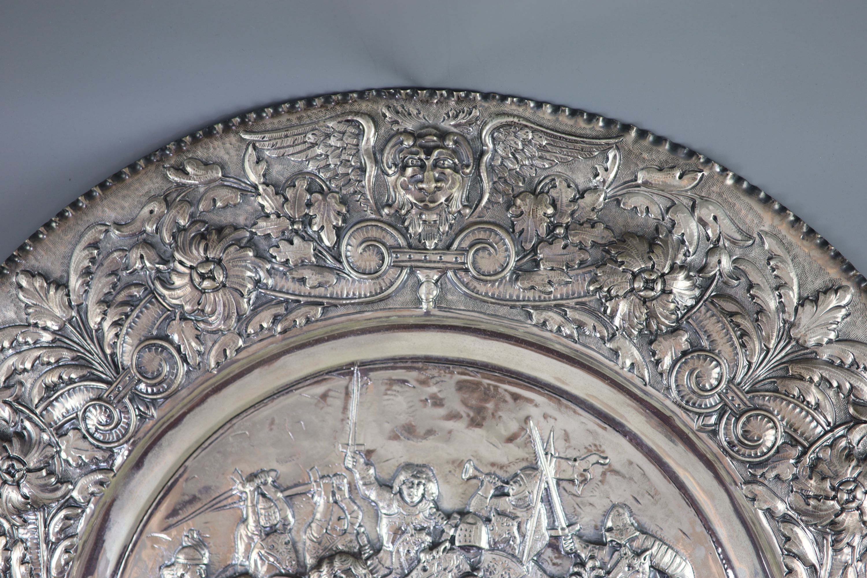 A large late 19th century Italian repousse 800 standard silver charger